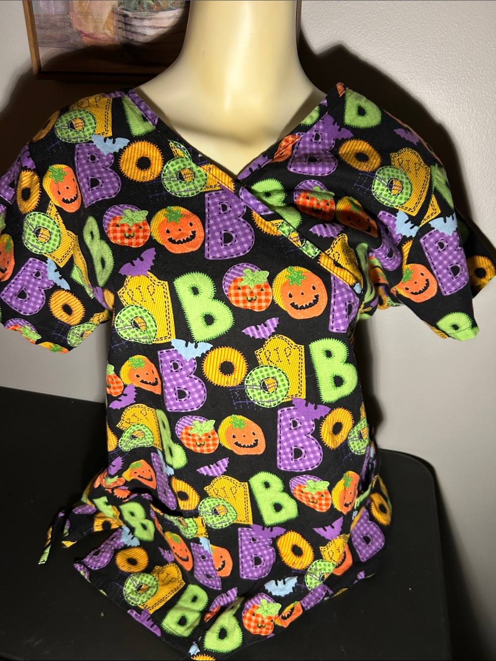 Halloween Print Black Scrub Top with Colorful Pumpkins and “BOO”